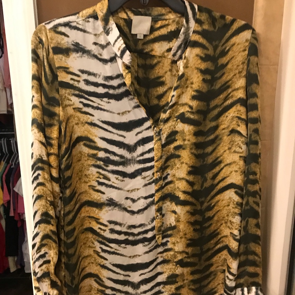 Semi sheer animal print v-neck blouse.